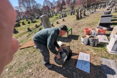 The cemetery helper filled in the hole and put the sod back on top.