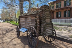 A miniature log home, across from the Lincoln home