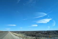 Wispy clouds in clear sky