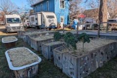Back yard - garden beds in front (side panels by Michael), my trailer in back