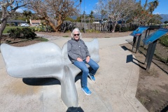 Karleen sitting on a whale tail