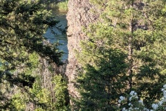 See the vertical wall and the river below