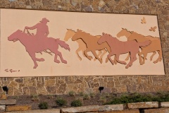 Cowboy and wild horses