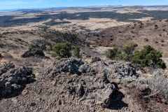 Parking is WAAAYYYY down there. Rough rocks are likely caused by spewing lava