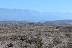 The Rio Grande River is way off in the distance, you can only see a small white area in the middle