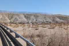 As we crossed the river bed the white rock formations are on the right